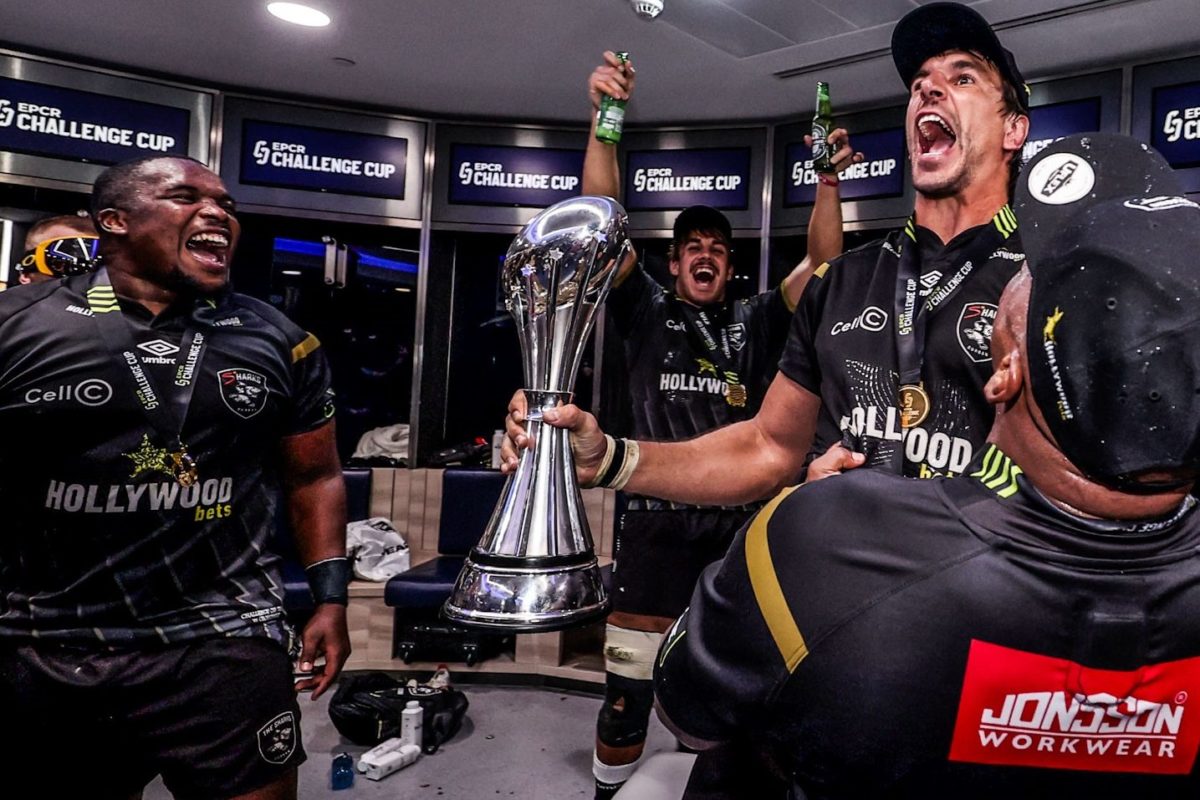 EbenEtzebethcelebrateswithSharks-e1716631235222.jpg