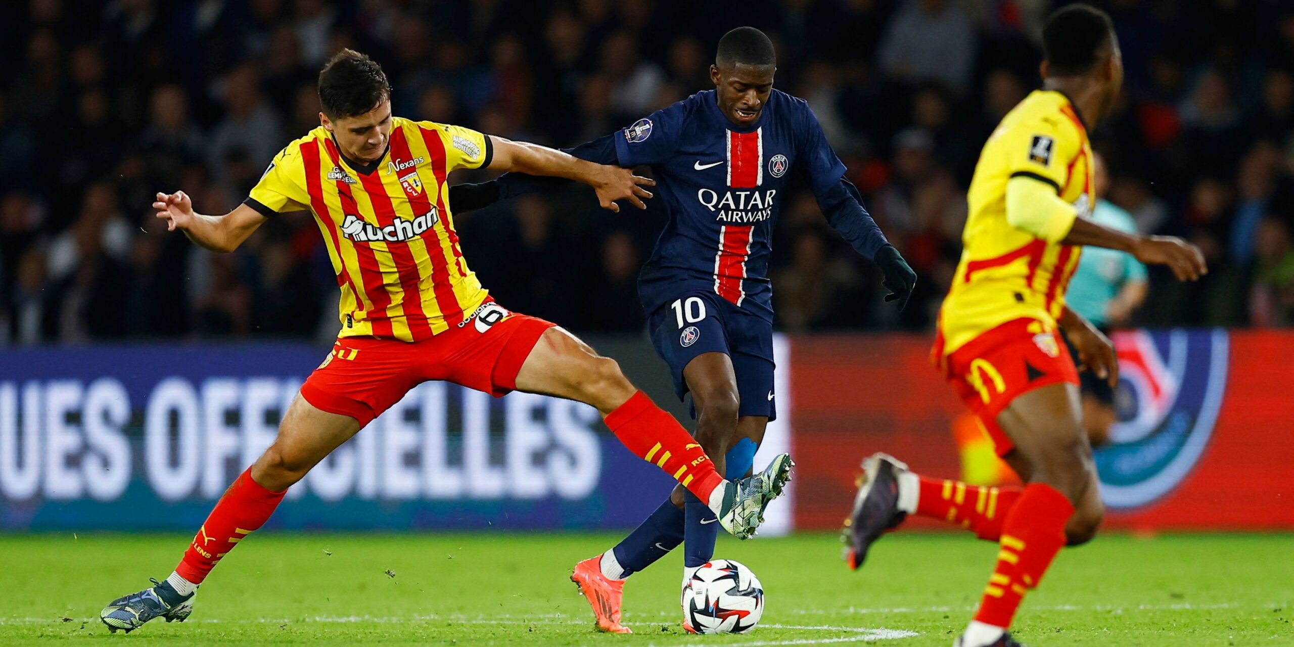 paris-st-germain-s-ousmane-dembele-in-action-with-rc-lens-abduqodir-khusanov.JPG