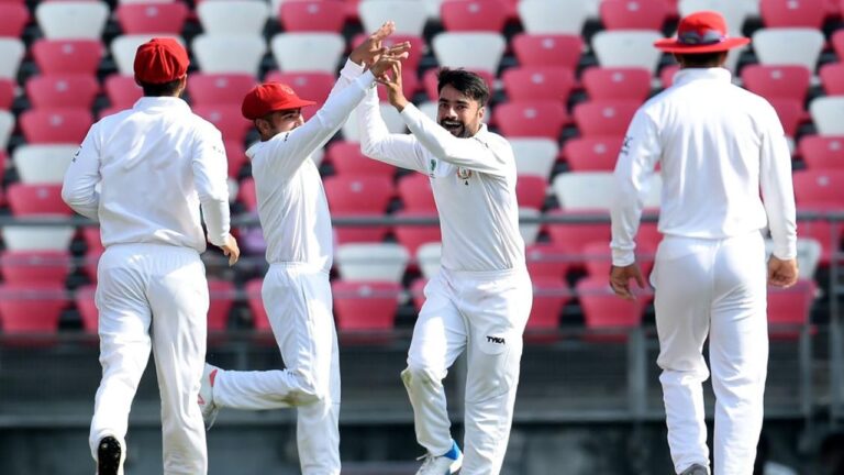 Rashid-Khan-celebrates-with-his-Afghanistan-teammates.jpg