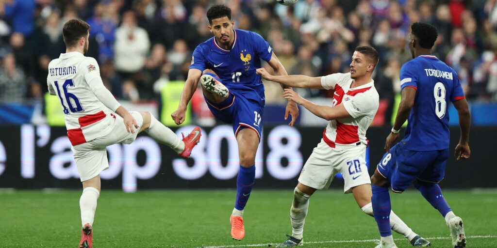 france-s-william-saliba-and-aurelien-tchouameni-in-action-with-croatia-s-martin-baturina-and-franjo.jpeg