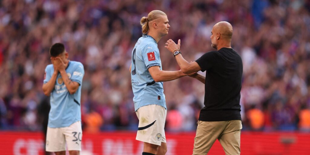 manchester-city-s-erling-haaland-and-manager-pep-guardiola.JPG