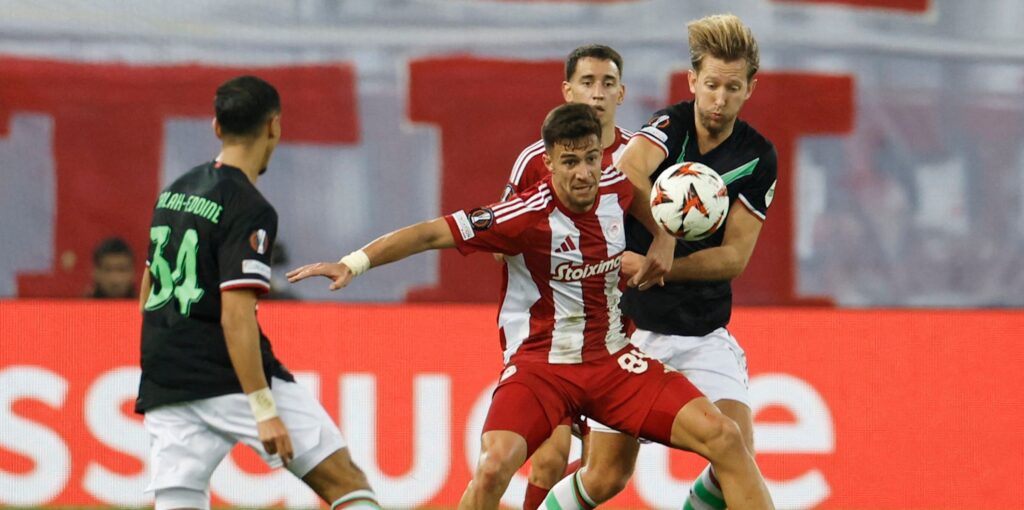 olympiacos-charalambos-kostoulas-in-action-with-fc-twente-s-michel-vlap.JPG