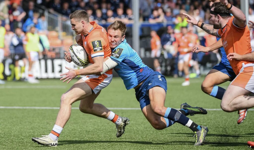David-Kriel-tackles-Euan-Cherry-Getty-Images-e1749624126928.jpg