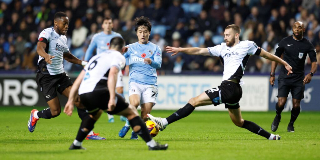 coventry-city-s-tatsuhiro-sakamoto-in-action-with-derby-county-s-ebou-adams-and-nathaniel-phillips.J.jpeg